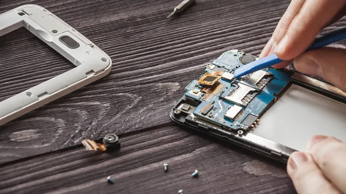 A cell phone being taken apart.